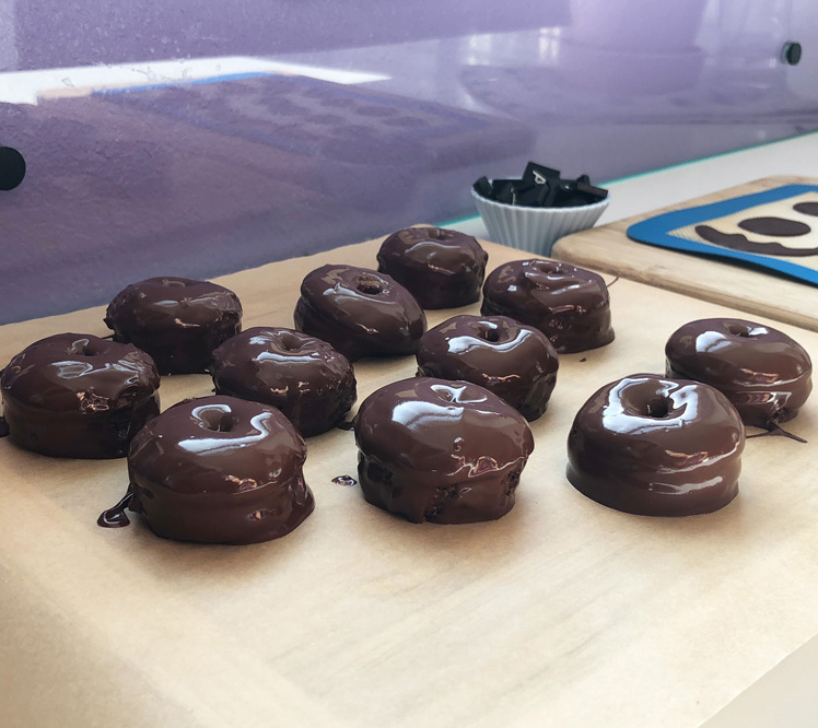 mini pumpkin spice donuts dipped in chocolate