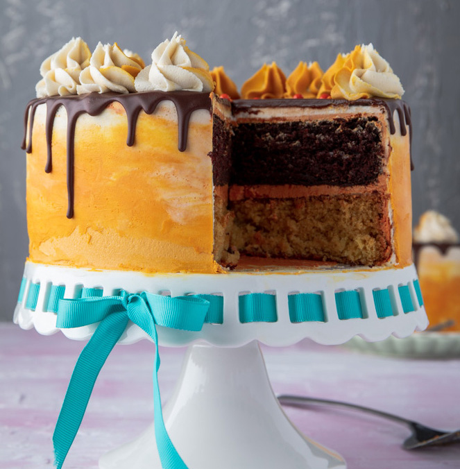 Vegan Chocolate Orange Cake with a slice removed to see the layers