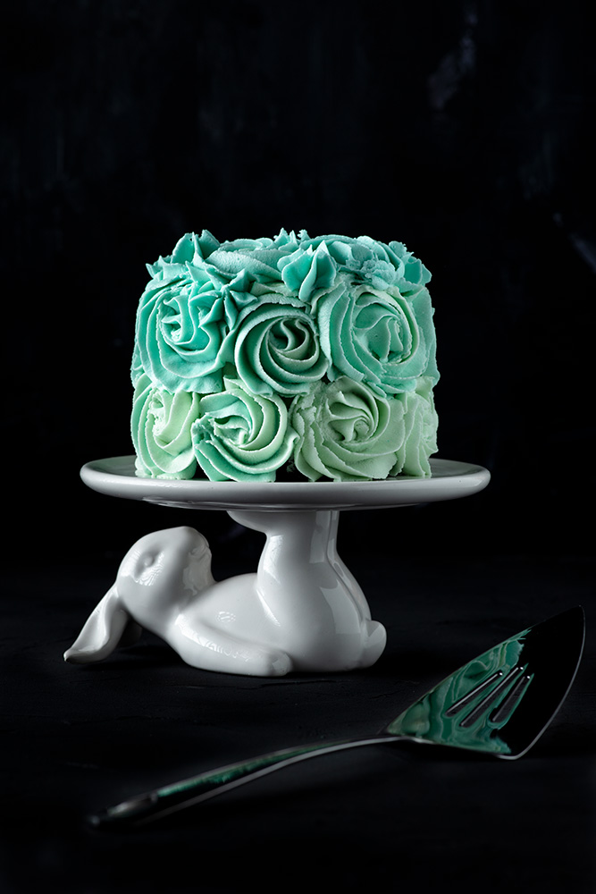 mini vegan birthday cake decorated with blue ombre roses