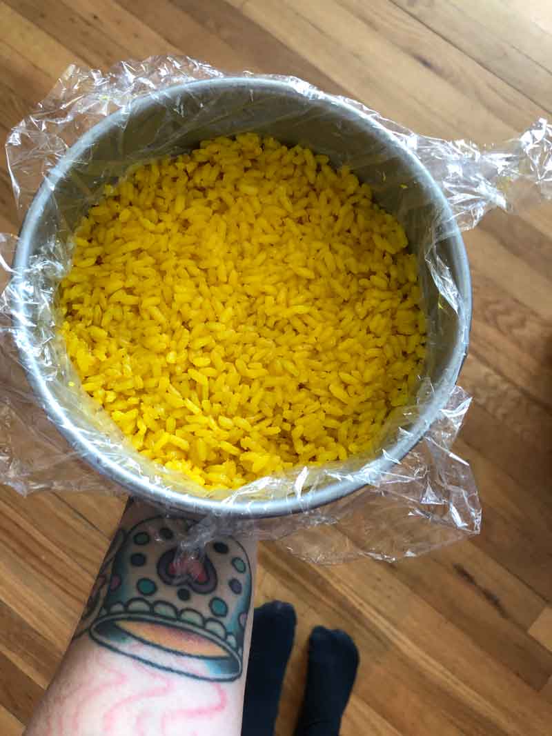turmeric sushi rice in a cake pan